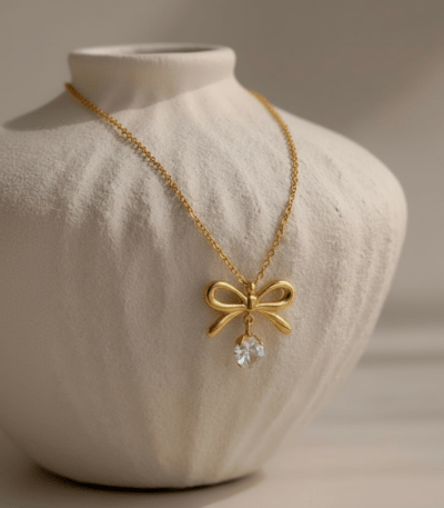 Gold Bow Necklace with Heart-Shaped Diamond Pendant