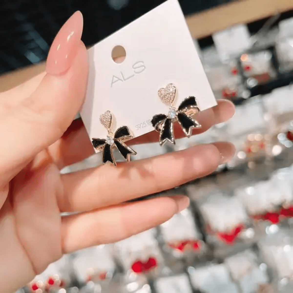 Elegant Heart & Bow Black Drop Earrings - Image 2