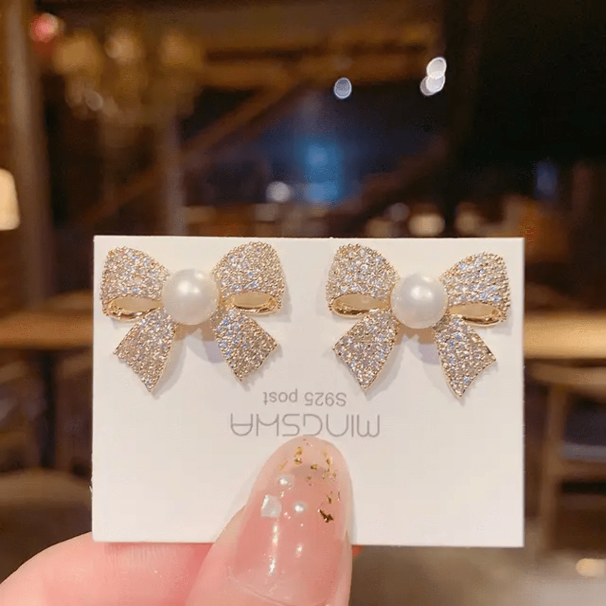 Elegant Pearl Bow Stud Earrings - Image 4