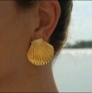 18k gold-plated seashell stud earring worn close-up on ear