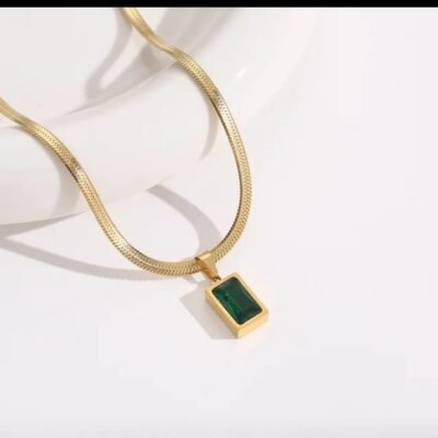 Emerald pendant necklace with green stone on flat gold chain