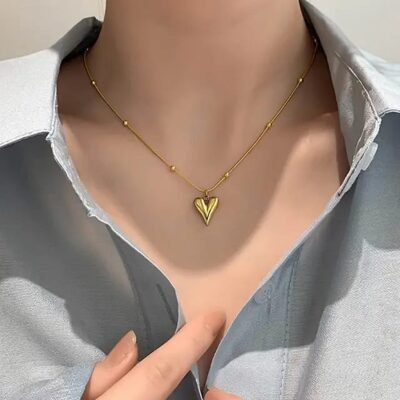 Gold satellite chain necklace with elongated heart charm pendant