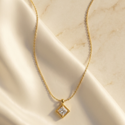 Gold CZ necklace with square stone in diamond-shaped frame pendant