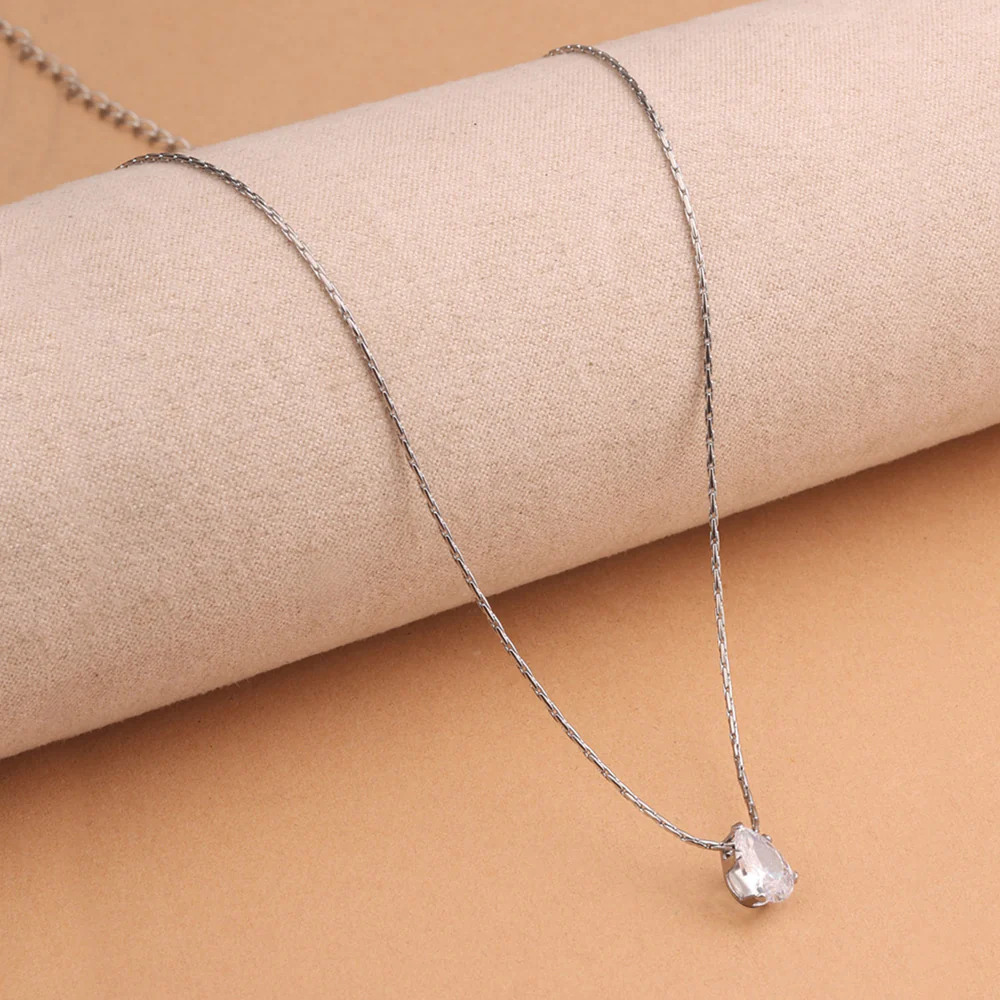 Minimalist silver chain necklace with single pear-shaped CZ pendant