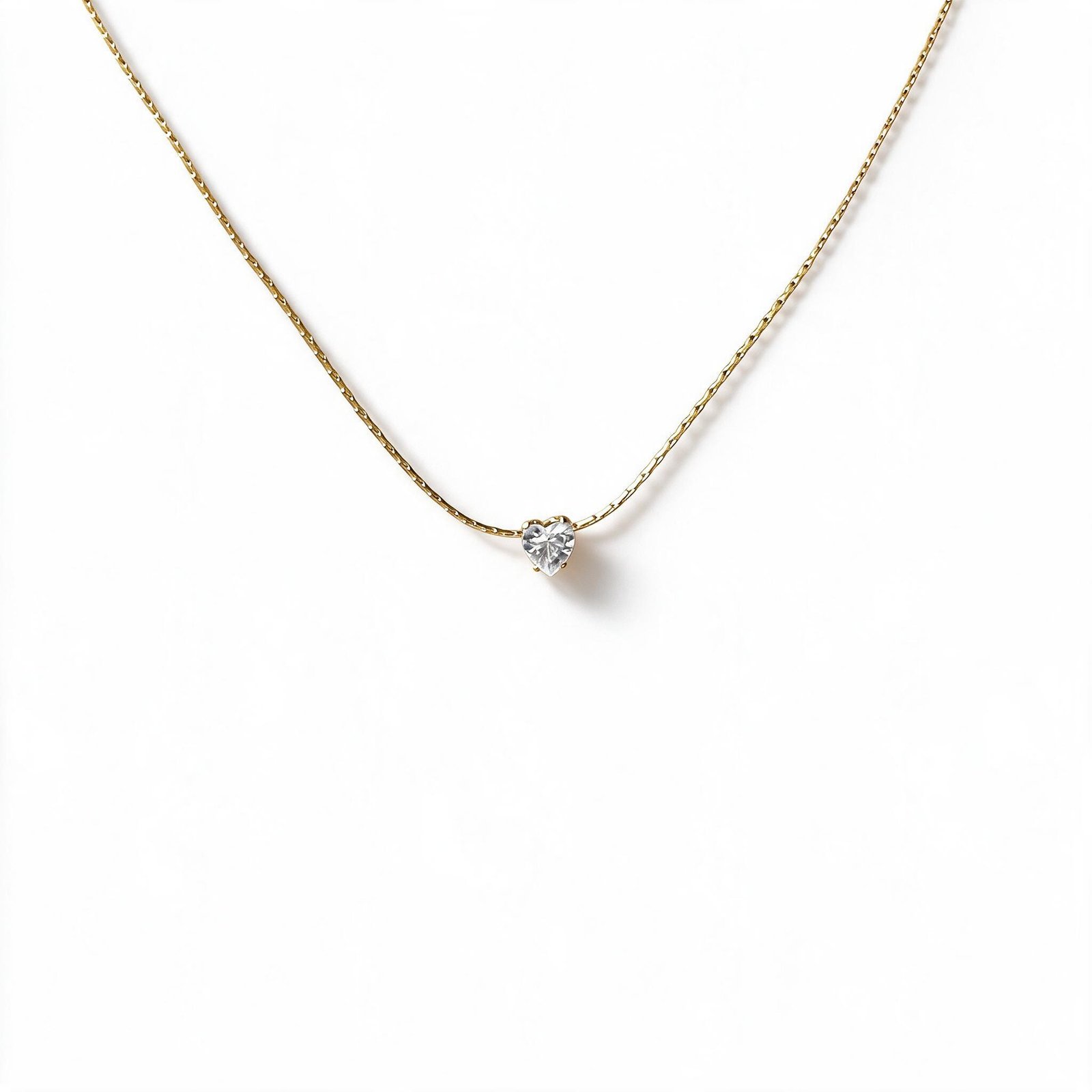 Dainty gold necklace with sparkling heart-shaped crystal pendant