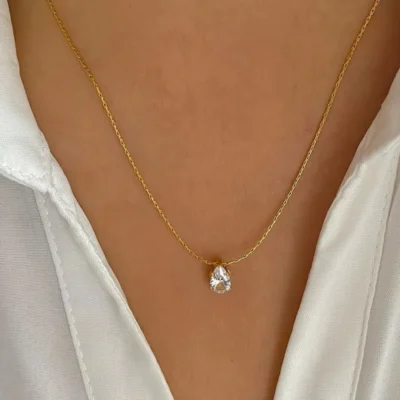 Dainty gold necklace with sparkling teardrop pendant