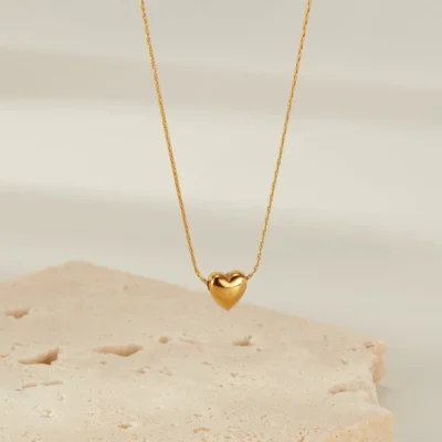 Gold heart pendant necklace with rounded 3D charm on delicate chain