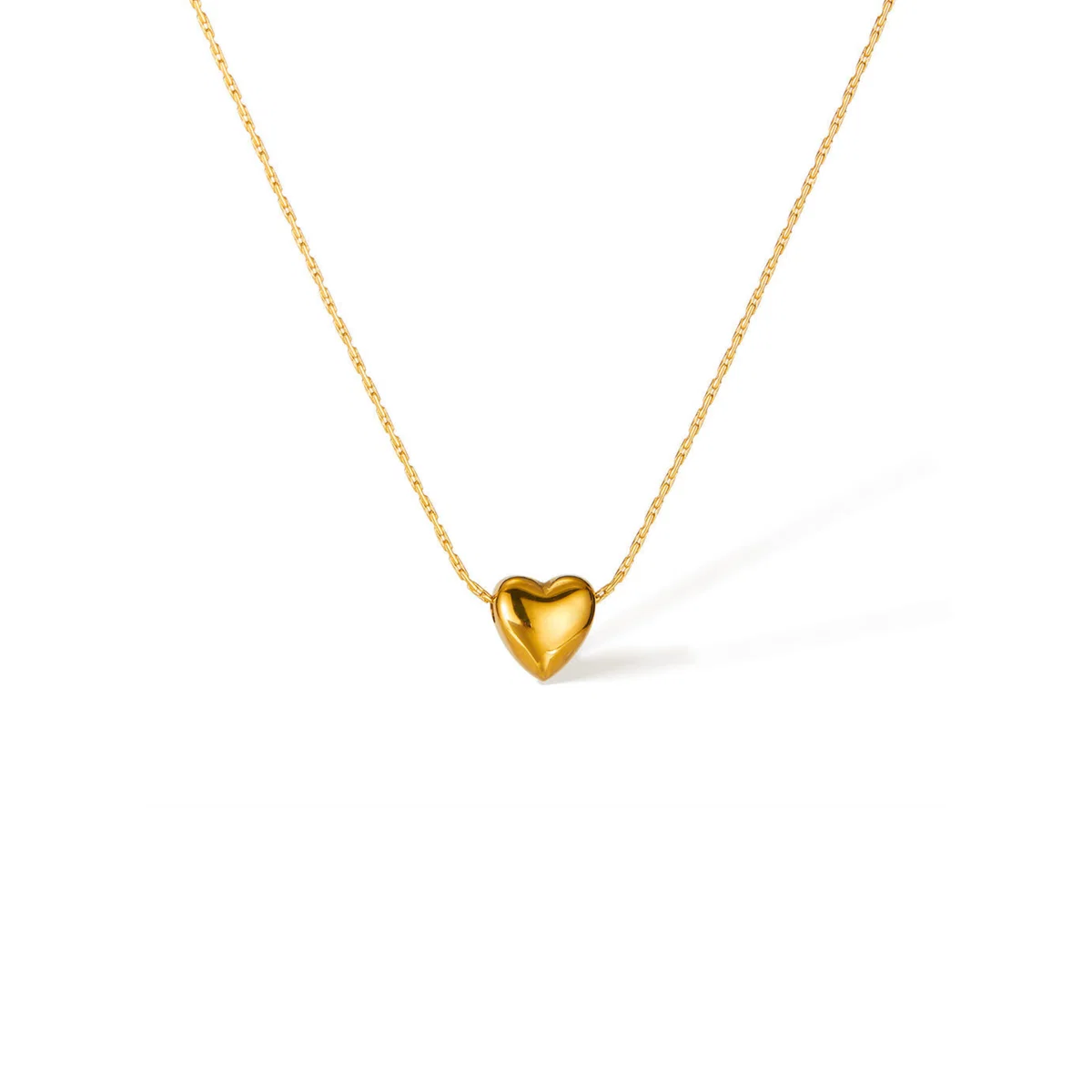 18k gold-plated puffy heart pendant on fine chain against white background